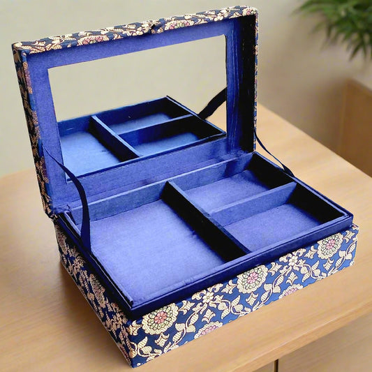 A beautiful jewelry box with intricate zardosi work, embroidered with golden wire.