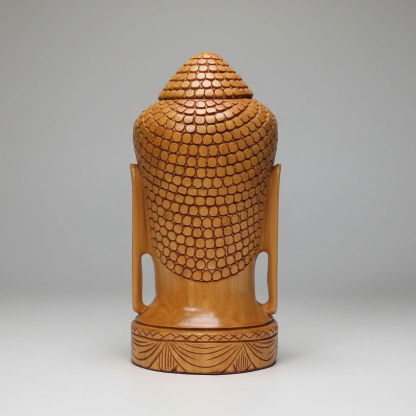 Bottom view showing the stable 10cm circular base of the cylindrical Buddha head sculpture, highlighting the solid hardwood construction.