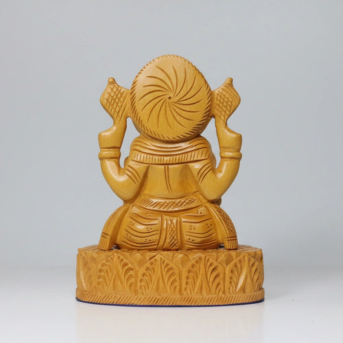Bottom back view of the 10cm wide rectangular base of a solid wood Ganesha, showing the stable construction.