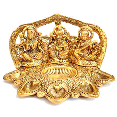A 12cm golden metal idol with a Panch Deepak and dhupbatti stand, perfect for a puja room.