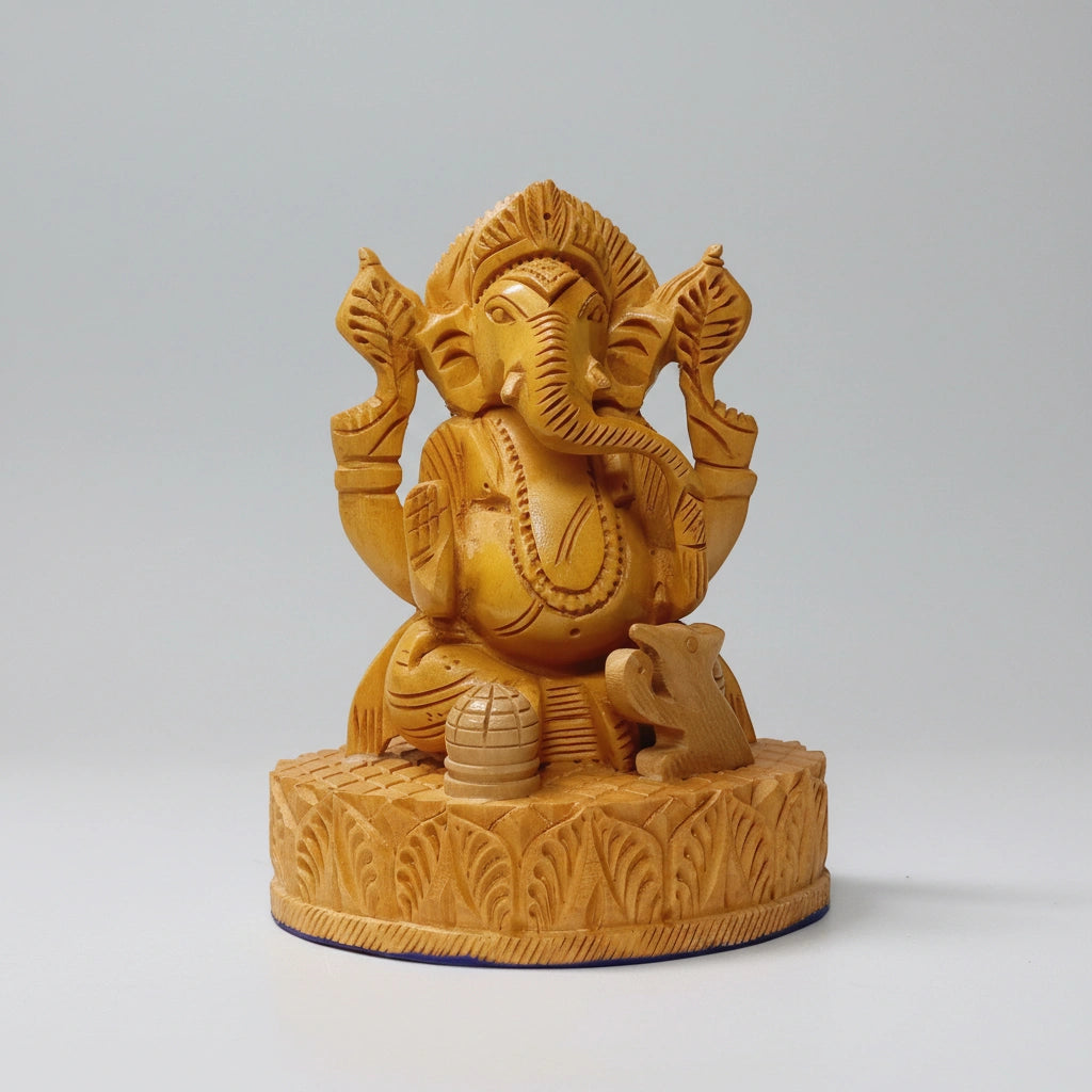 Front view of a 13cm compact wooden Ganesha statue showing the hand-carved crown and trunk on natural timber.