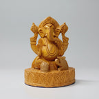 Front view of a 13cm compact wooden Ganesha statue showing the hand-carved crown and trunk on natural timber.