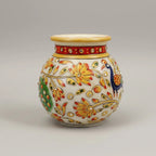 A 13cm marble Kalash pot featuring an ornate carved finish, suitable for storing holy water or as a decorative spiritual centerpiece.