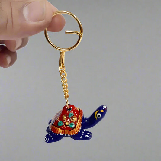 Handcrafted metal tortoise keychain in traditional Meenakari art