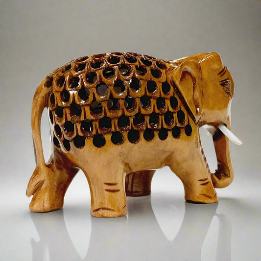 Wooden elephant figurine with detailed undercut carving in natural finish