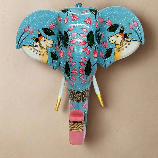Hand-painted wooden elephant mask wall hanging with intricate floral motifs