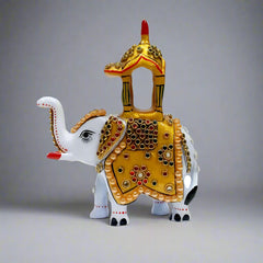 Hand-painted metal elephant with vibrant patterns and detailed craftsmanship