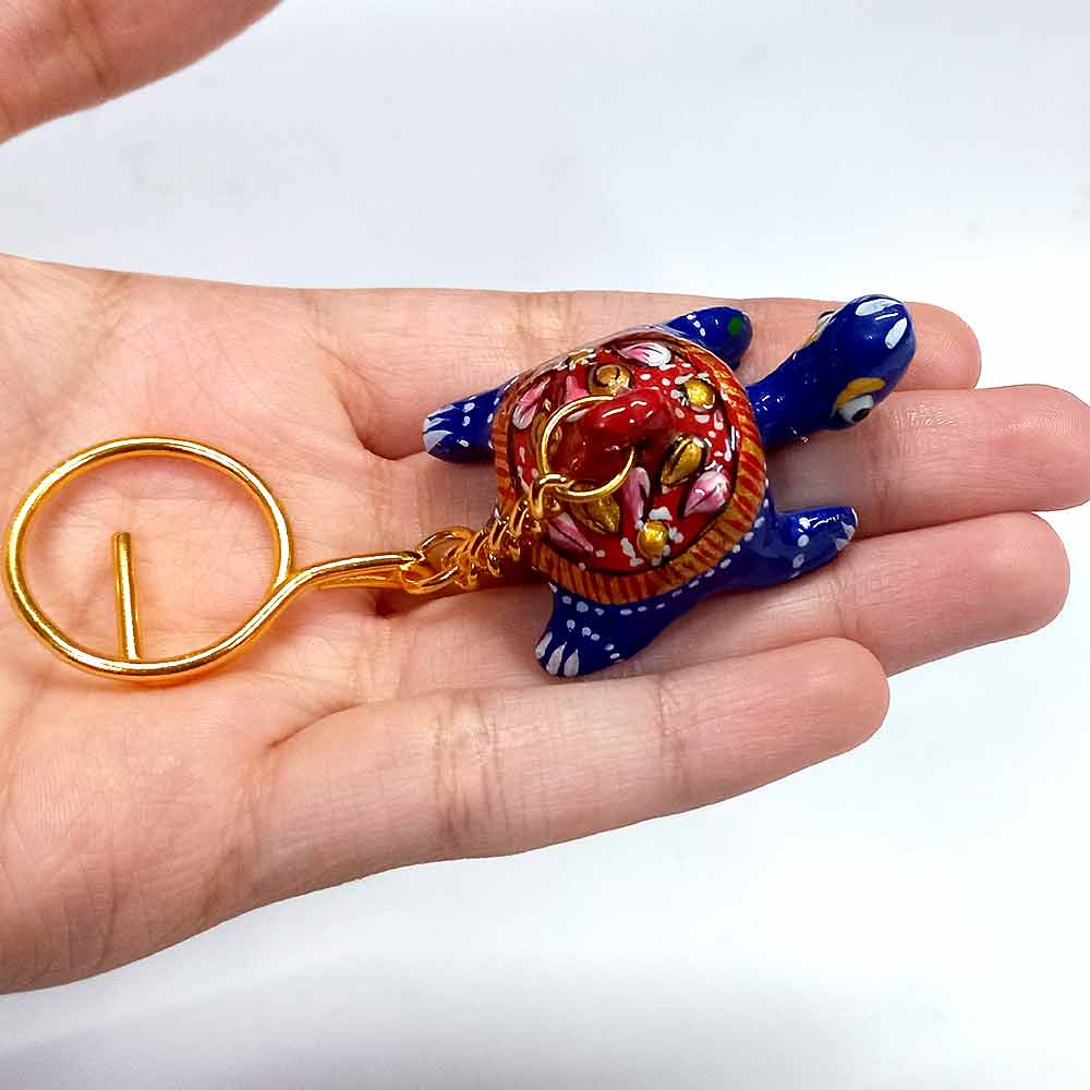Elegant tortoise-shaped keychain with vibrant Meenakari painting
