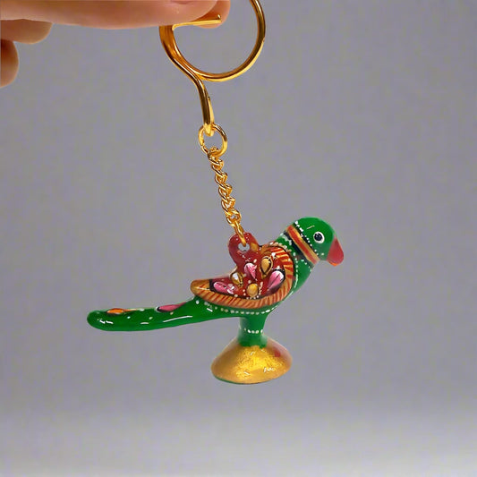 Hand-painted Meenakari parrot keychain with vibrant enamel detailing.