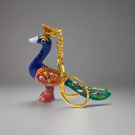 Elegant metal keychain featuring traditional Meenakari peacock design.