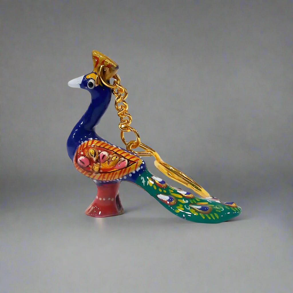 Durable metal peacock key holder with exquisite Meenakari detailing.