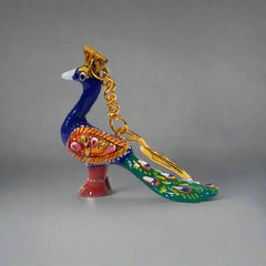 Durable metal peacock key holder with exquisite Meenakari detailing.