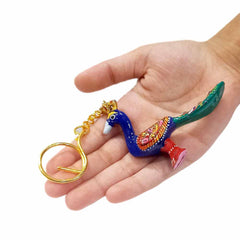 Unique handcrafted peacock keyring with colorful Meenakari painting.