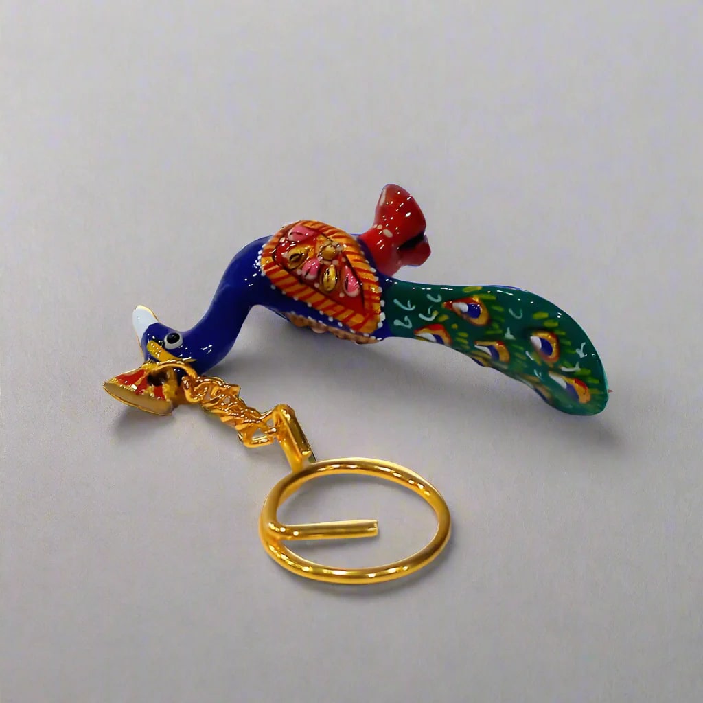 Artistic enamel-painted Meenakari peacock keychain for daily use.