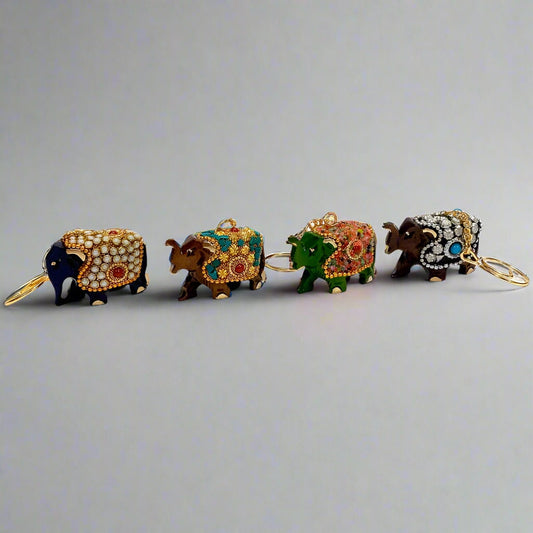 Artistic wooden keychain featuring elephant design with intricate beadwork.
