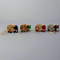 raditional handcrafted wooden elephant key holder with stone embellishments.