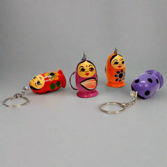Compact wooden doll keychain, perfect accessory for keys and bags.
