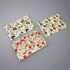 Stylish Navratri clutch bag adorned with fine zari embroidery, adding a touch of sophistication