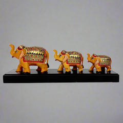Charming wooden elephant family on a bridge platform, perfect for adding whimsy and warmth to any space