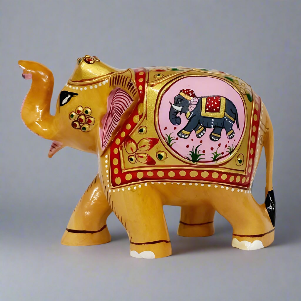 Kadamb wood carved elephant with detailed embossed artwork and trunk raised symbolizing good luck and prosperity, measuring 10cm tall.