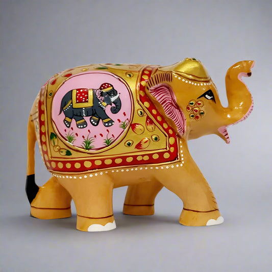 Handcrafted wooden elephant statue made from durable Kadamb wood, featuring intricate embossed painting and a miniature painted elephant detail.