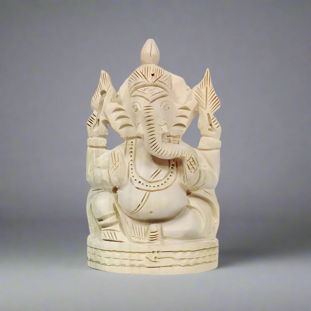 Handcrafted Sevan wood Ganesh statue with intricate details, radiating positive energy and spiritual blessings