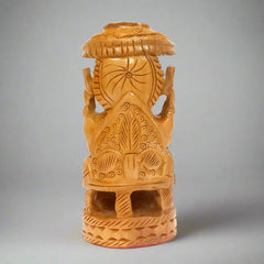 Elegant wooden Ganesh idol featuring traditional craftsmanship and umbrella motif