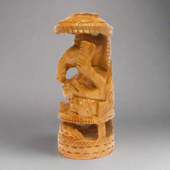 Wooden Ganesh statue with fine carving and umbrella, ideal for home altar and spiritual spaces