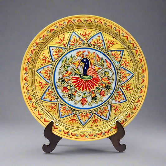 Round marble plate featuring vibrant hand-painted peacock and embossed floral patterns, showcasing intricate artistry and elegant colors.