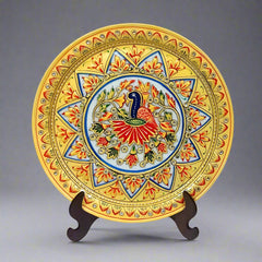 Round marble plate featuring vibrant hand-painted peacock and embossed floral patterns, showcasing intricate artistry and elegant colors.
