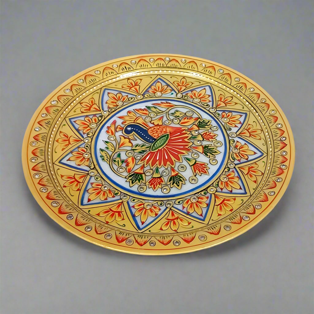 Luxurious marble plate adorned with detailed peacock painting and raised floral motifs, blending traditional craftsmanship with sophisticated design.