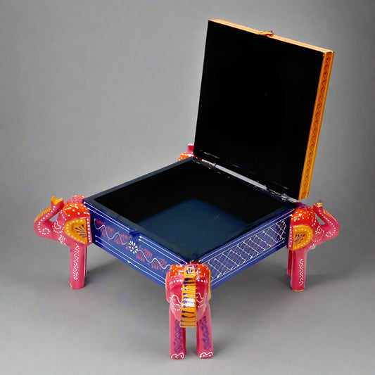 Artisan-crafted wooden jewelry box with vibrant elephant motif, embossed patterns, and soft velvet-lined compartments.