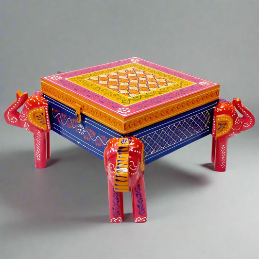Hand-painted wooden jewelry box with embossed elephant design and carved elephant legs, blending elegance and charm.