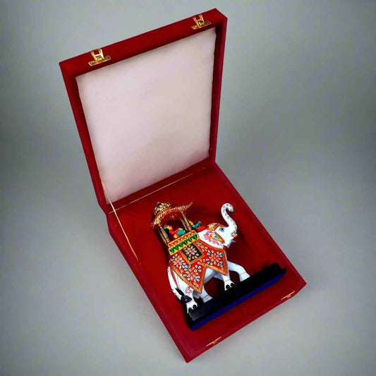 Handcrafted metal elephant showpiece featuring detailed Meenakari artwork, ideal for home décor or office gifting.