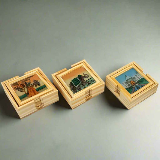 Artistic coaster set with vibrant Rajasthani motifs and a smooth-spinning wooden base for easy selection.