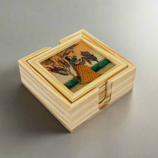 Handcrafted wooden coaster set with traditional Rajasthani gemstone paintings, displayed on a rotating pine wood stand.