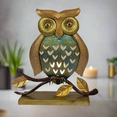 Antique metal owl tea light candle holder with intricate mesh design.