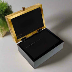 Decorative box with carved brass artwork on top, polished for a vintage charm. Suitable for trinkets, jewelry, or spiritual essentials.