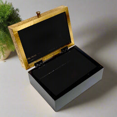 Decorative box with carved brass artwork on top, polished for a vintage charm. Suitable for trinkets, jewelry, or spiritual essentials.