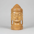 Frontal view of a 20cm hand-carved Kadamba wood Buddha head showing symmetrical facial features and a polished natural grain finish.