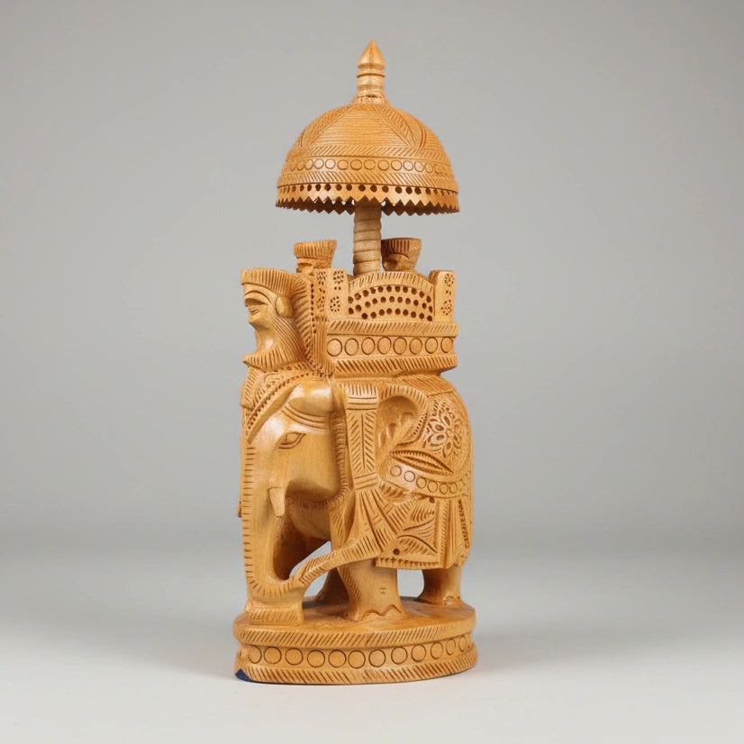A 23cm tall traditional wooden Ambabari elephant showing the scale and height for office desk decor.