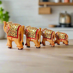 A 4-piece set of wooden elephants, beautifully hand-painted with unique designs.