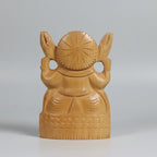 Perspective view of the 7cm wide base of a solid timber Ganesha idol, showcasing the stability and natural wood grain of the hand-carved piece.