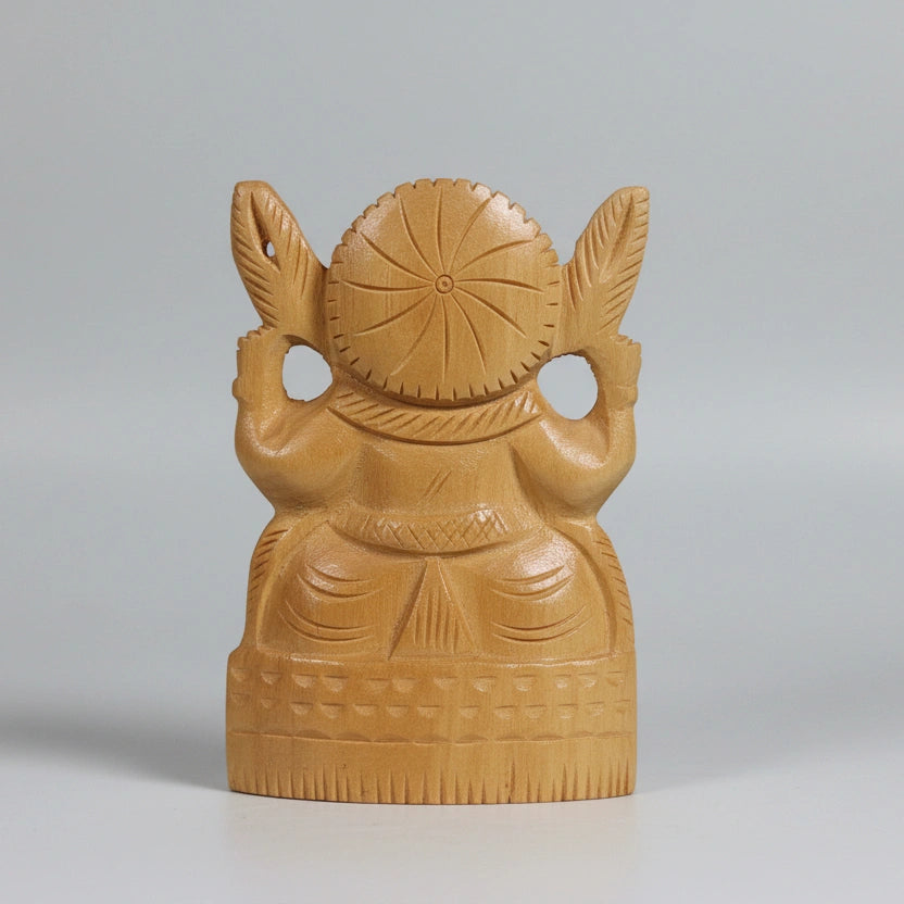 Perspective view of the 7cm wide base of a solid timber Ganesha idol, showcasing the stability and natural wood grain of the hand-carved piece.