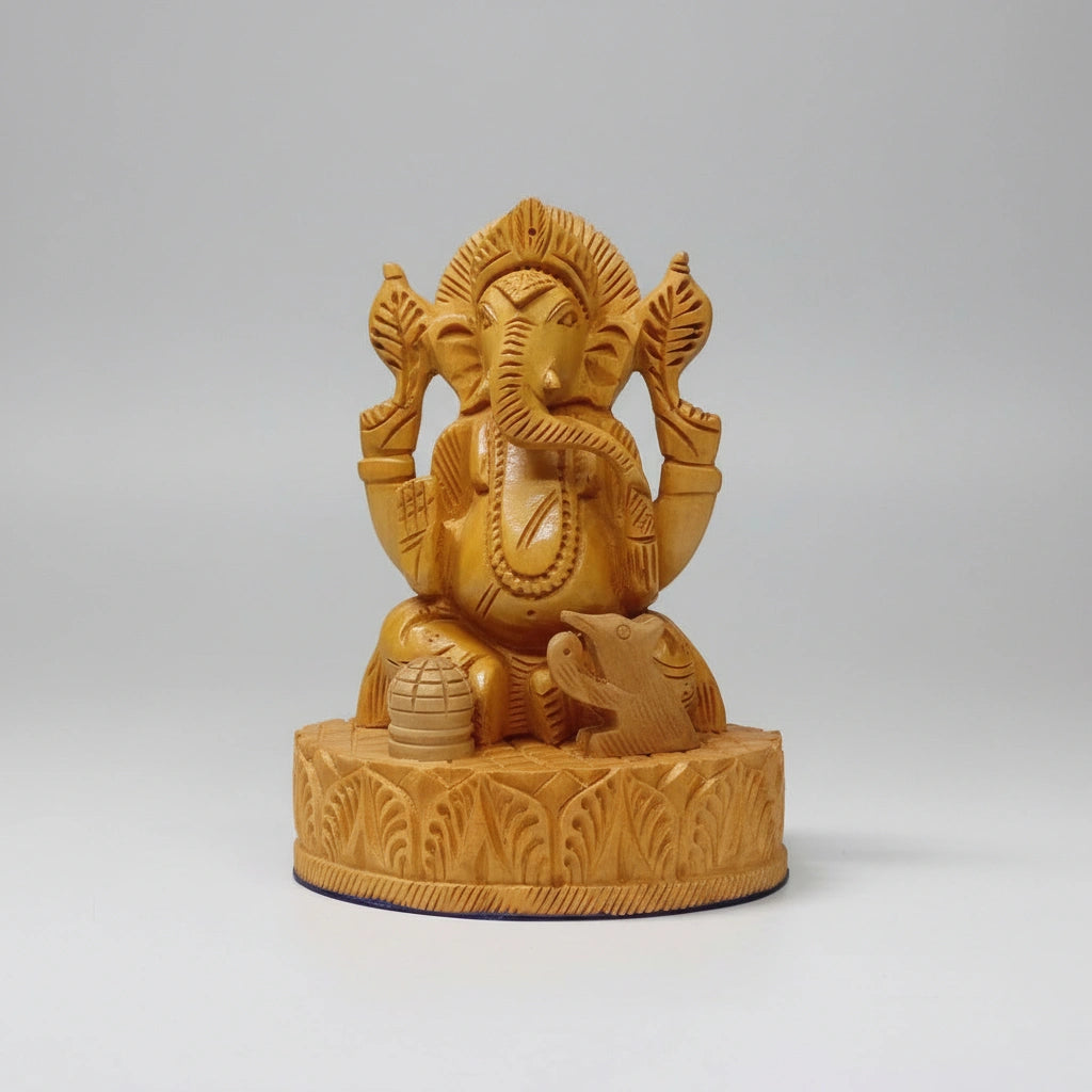 Side view highlighting the 8cm depth and thickness of the 13cm tall hand-carved wooden Ganesha.