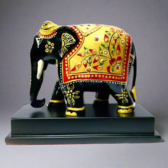 Intricately painted wooden elephant memento for home or office decor