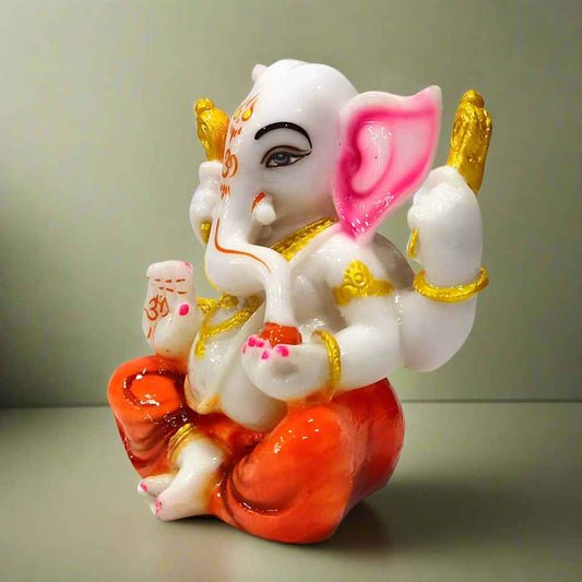 Graceful resin figurine of Lord Ganesha, featuring fine craftsmanship and serene expression for divine ambiance.