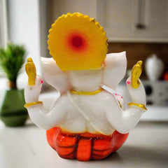 Serene white Ganesha murti made from high-quality resin, perfect for home temples, office desks, or gifting.