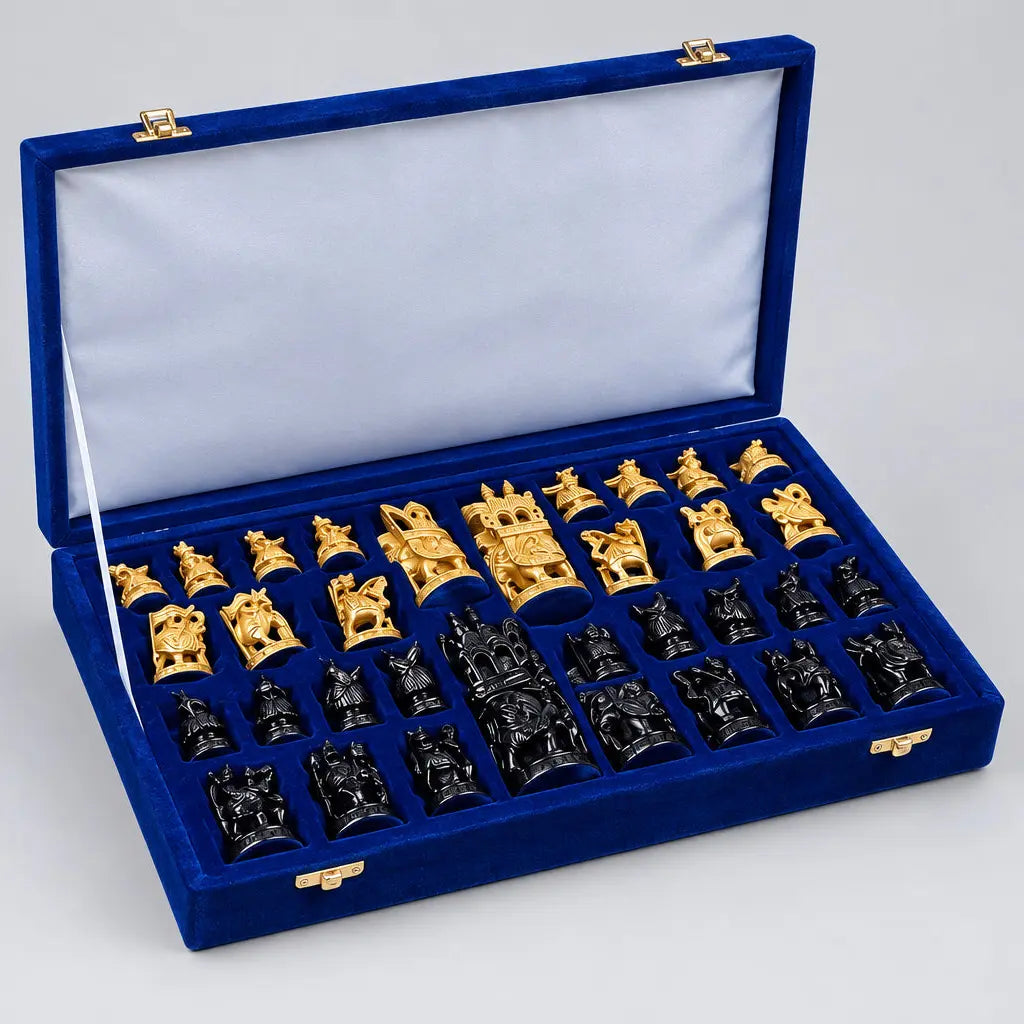 Natural wood-toned and black Ambabari chess pieces arranged in a blue-lined storage box with a velvet box