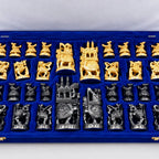 Close-up of carved wooden Ambabari chess pieces with elephant and animal designs on a chessboard